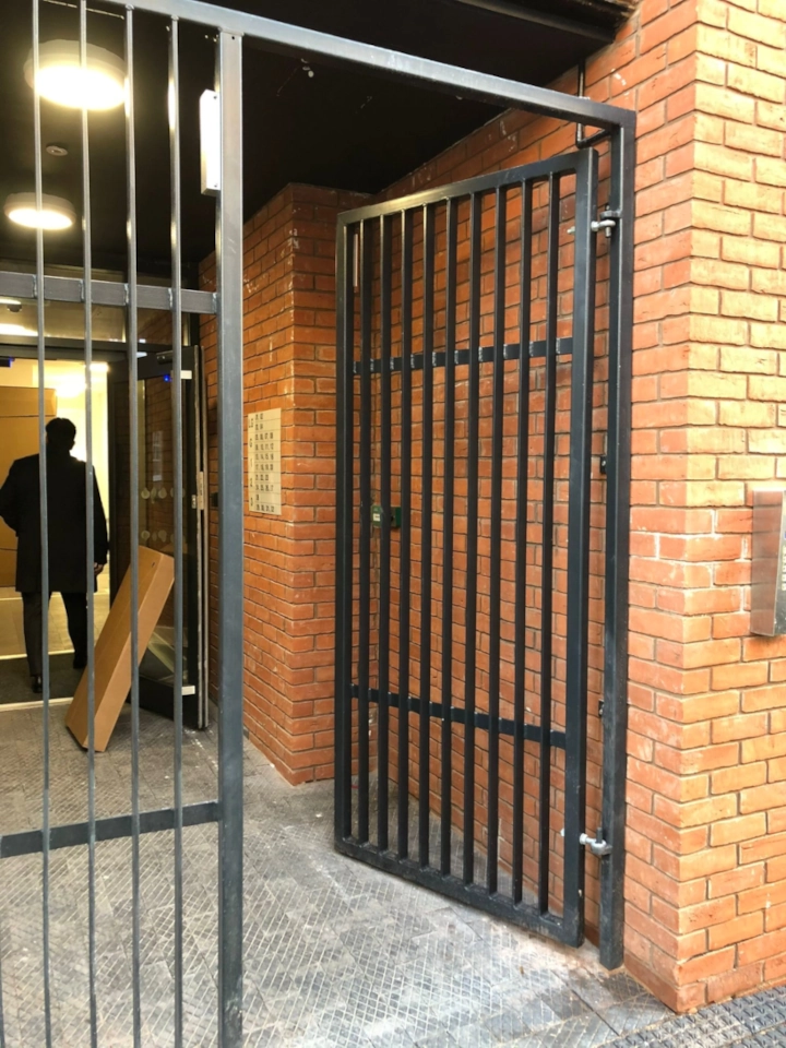 External boundary gates installed at building entrance.