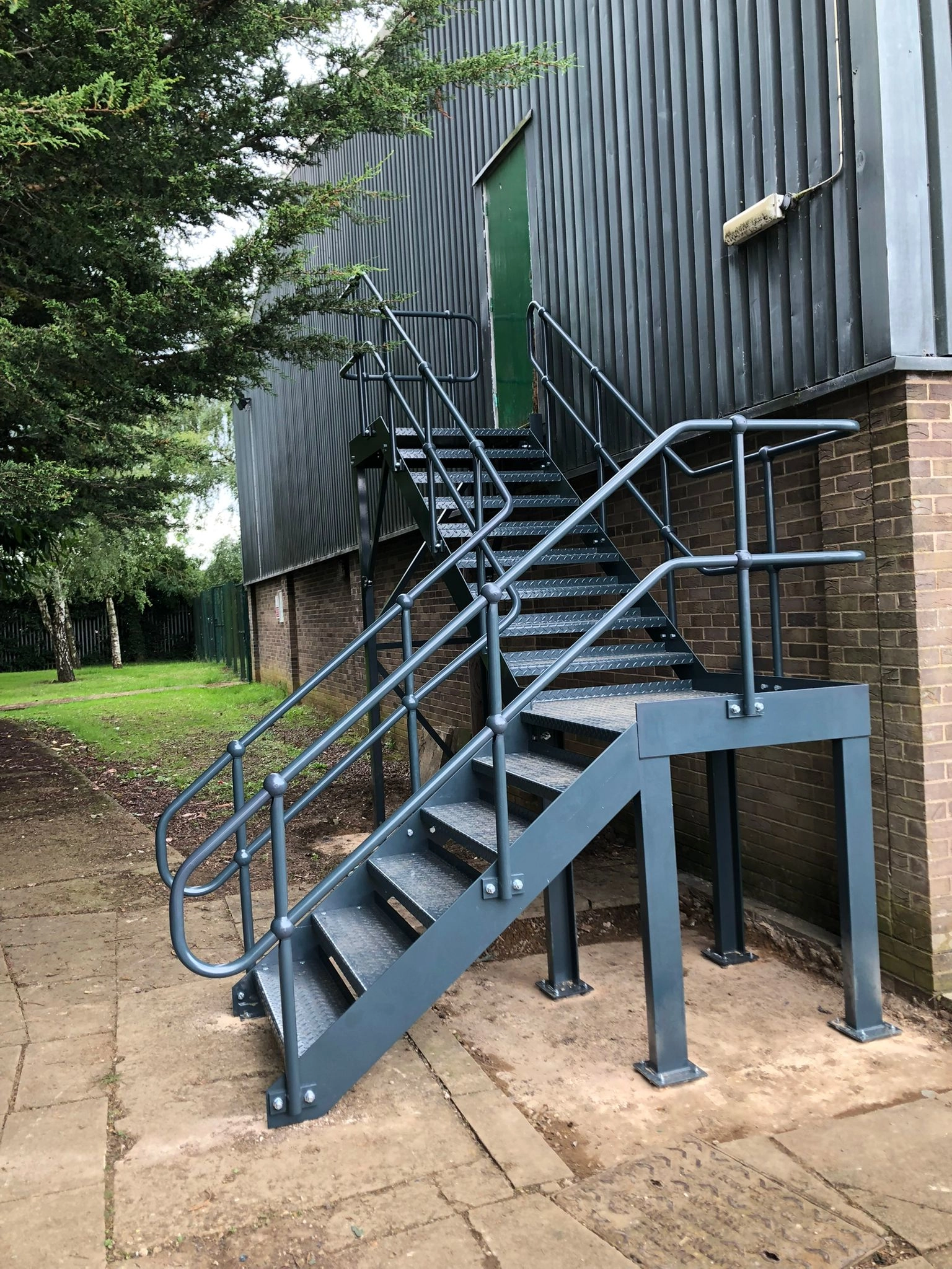 outside staircases providing access to the ground floor, none slip steps and handrails 