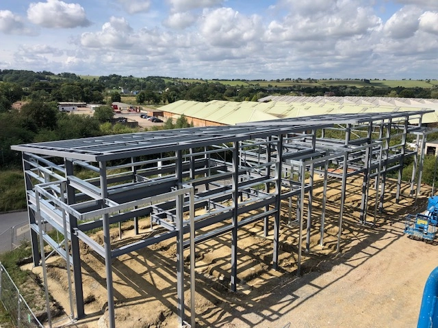 Old Dalby - 46 Ton showing structural steel framework of a commercial / industrial building under construction.
