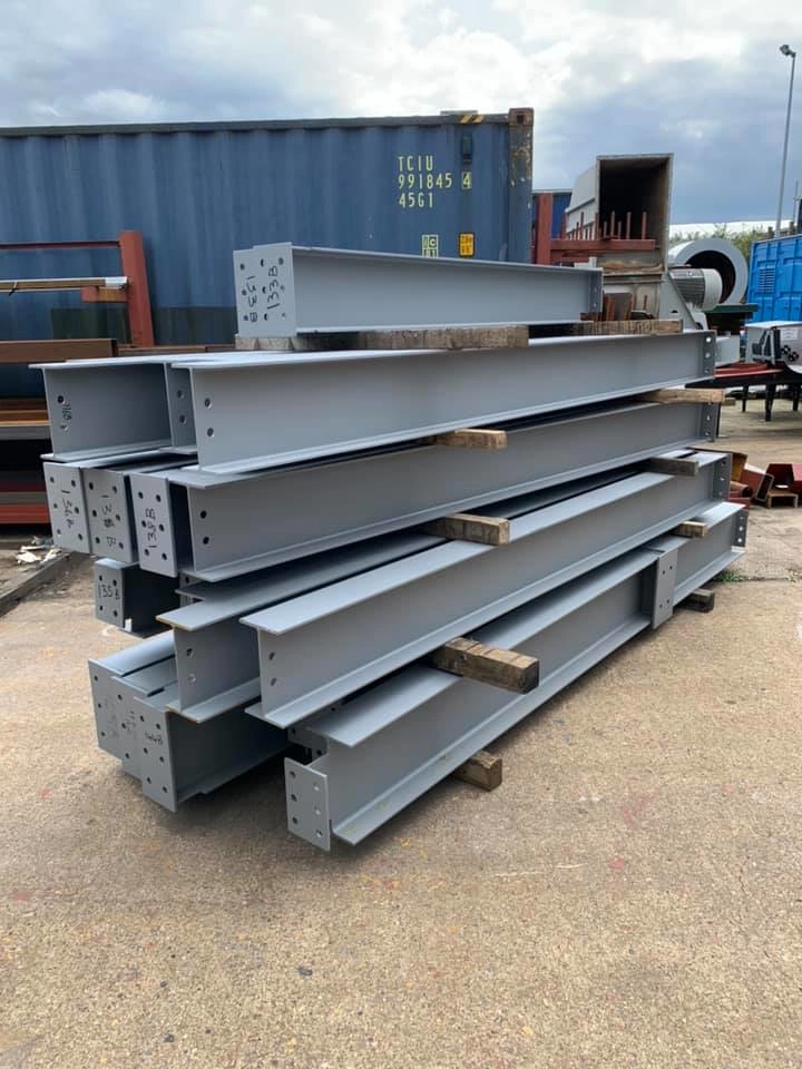 stacked H & I beams ready for delivery to site, pre fabricated structural steel beams