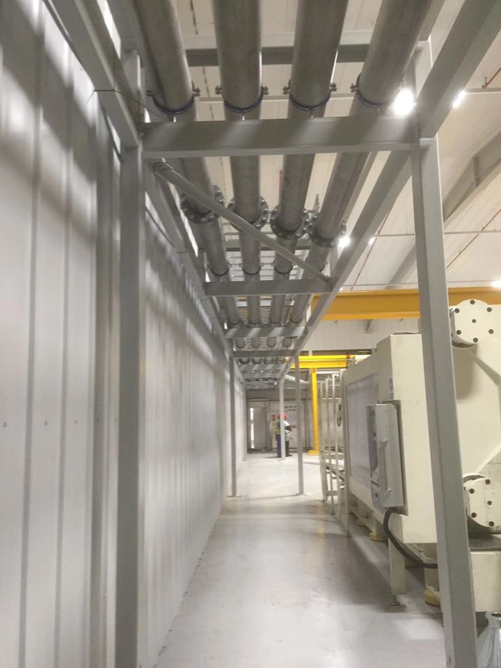 Industrial service gantry showing overhead pipe work