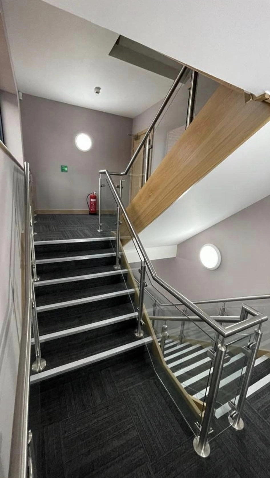 a picture showing a stainless steel and glass multi floor handrail.