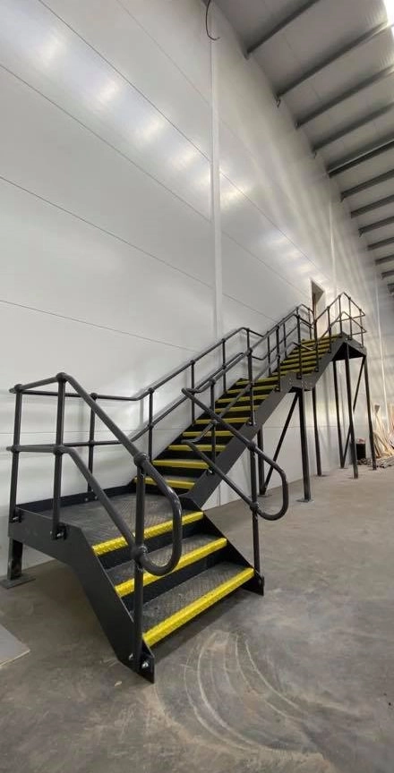 A full Indoor staircases complete with handrail, powered coated black with no slip, full grip steps.