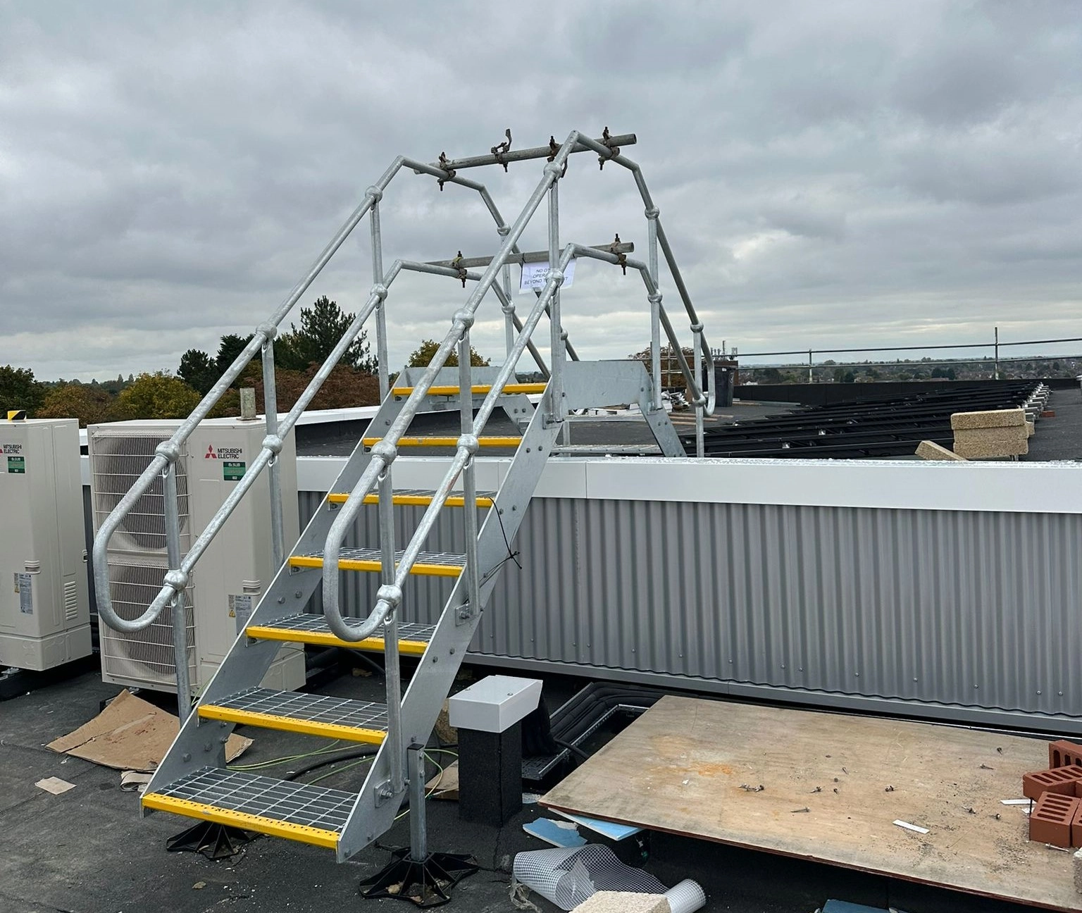 High roof stepover designed to navigate larger rooftop obstructions safely