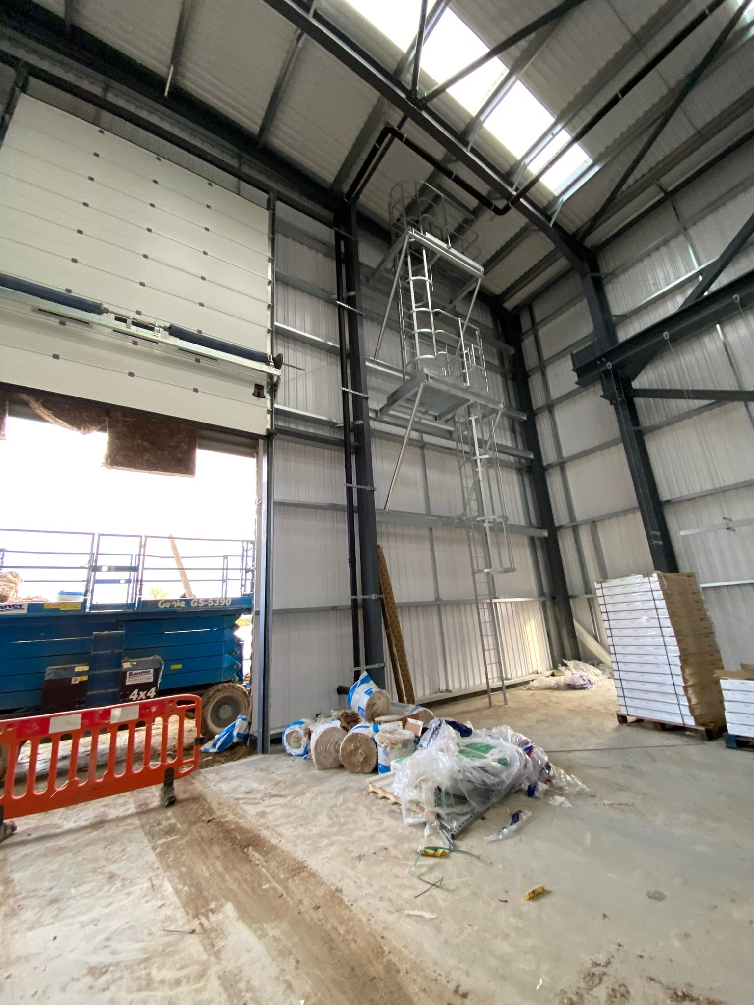 side building split two tier access ladder and platform.