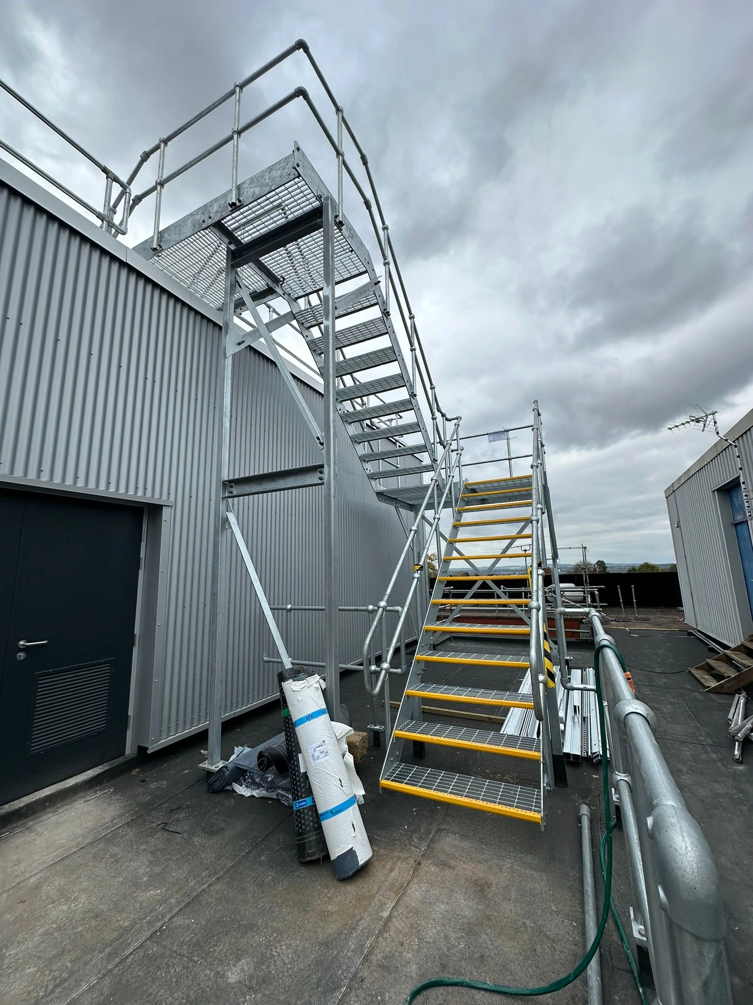a side staircases to roof access with high advisability steps.